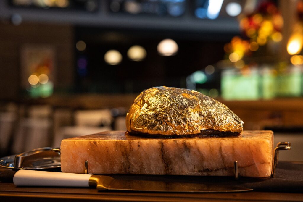 The Golden Steak® is the most noble part of the top sirloin, expertly seasoned with salt and then decadently enveloped in 24-karat edible gold foil. A bespoke cart approaches your table, presenting the Golden Steak® in all its splendor, and the Gaucho Chef then artfully carves this luxurious meat selection with a golden knife.

Elevate your dining experience with every golden bite. Join us today at Galpão Gaucho Brazilian Steakhouse
✨💛 🥩

Which location are you heading to? 
Cupertino, CA
Irvine, CA
Napa, CA
Roseville, CA
San Diego, CA
Walnut Creek, CA
Las Vegas, NV
Charleston, SC